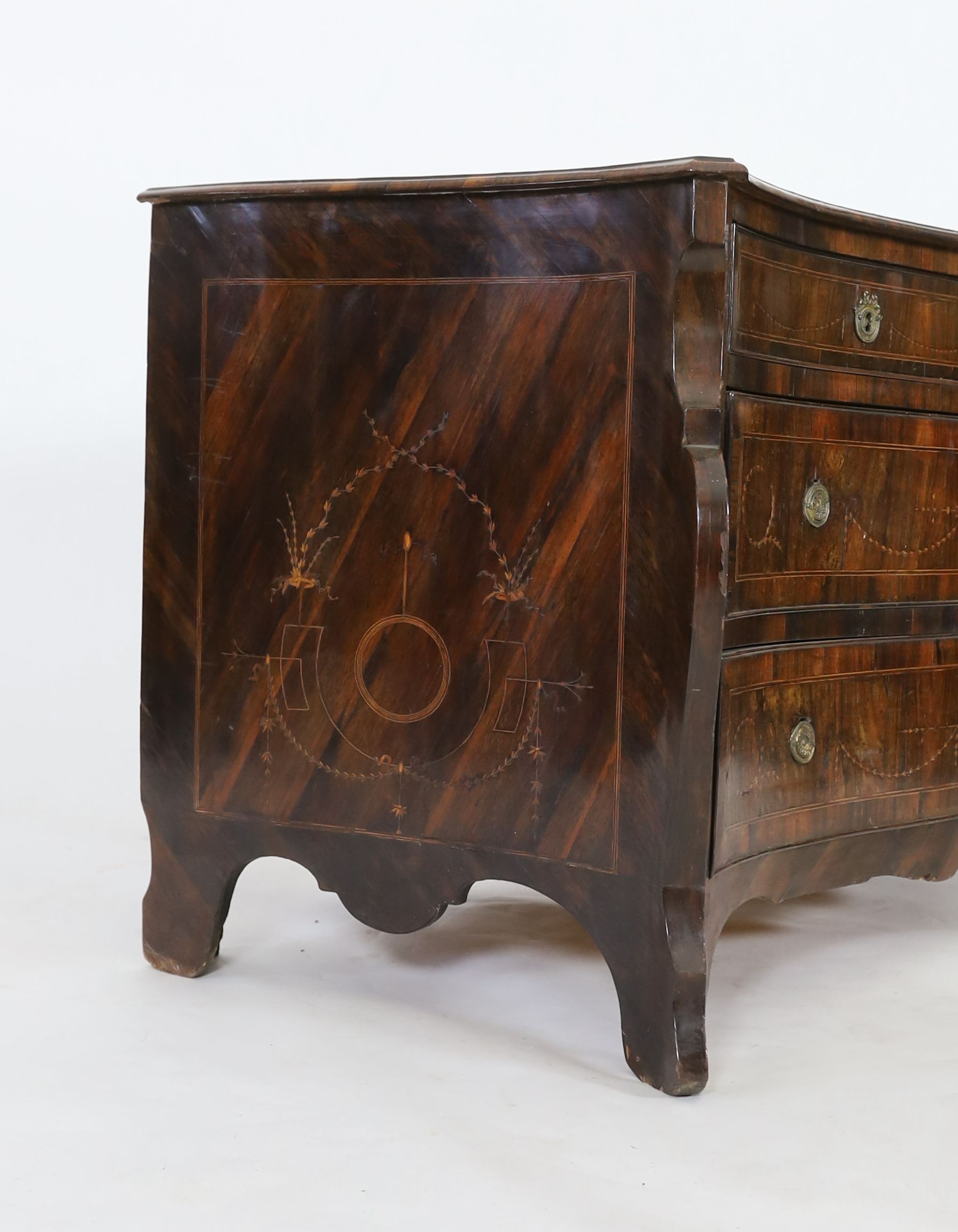 An 18th century North Italian marquetry inlaid kingwood serpentine commode, W.140cm D.67cm H.82cm